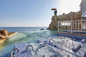 a swimming pool with a penguin on top of a building at Lotte Resort Sokcho in Sokcho
