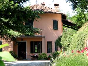 a large house with a garden in front of it at La Miseria in Ovada