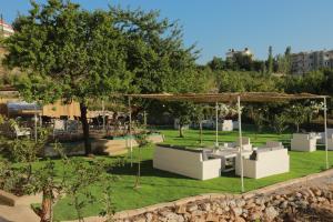 a garden with a pavilion and a swing at Beit Mirna Guesthouse & Chalet - Ehden in Ehden