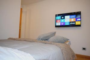 Un pat sau paturi într-o cameră la MaC Patagonia