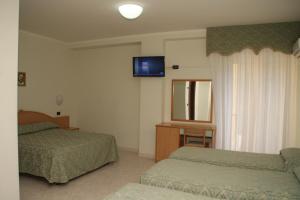 Ένα ή περισσότερα κρεβάτια σε δωμάτιο στο Hotel Garden +54 φωτογραφίες