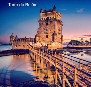 a building with a bridge in front of it at AL Belém 85 in Lisbon