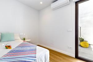 A bed or beds in a room at Townhouse Tonina