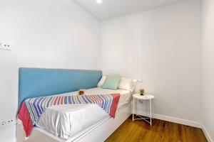 A bed or beds in a room at Townhouse Tonina