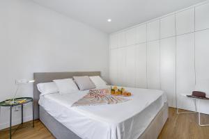 A bed or beds in a room at Townhouse Tonina
