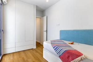 A bed or beds in a room at Townhouse Tonina