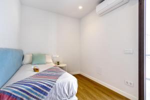 A bed or beds in a room at Townhouse Tonina