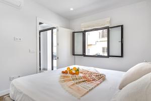 A bed or beds in a room at Townhouse Tonina