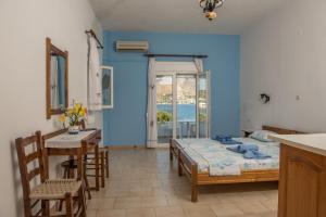 A bed or beds in a room at Olga Apartments