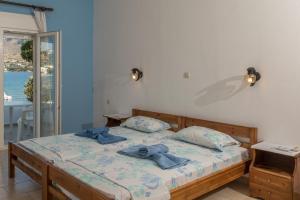 A bed or beds in a room at Olga Apartments