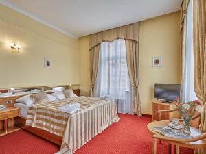 Postel nebo postele na pokoji v ubytování Hotel Sirius + 31 fotografií