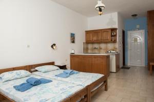 A bed or beds in a room at Olga Apartments