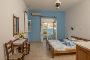 A bed or beds in a room at Olga Apartments