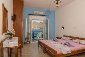 A bed or beds in a room at Olga Apartments