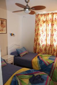 Tempat tidur dalam kamar di Casa Feliz en el complejo Las Fresas