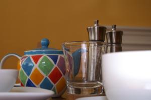 a table with a glass and bottles on it at Canal View Bed And Breakfast in Lincoln