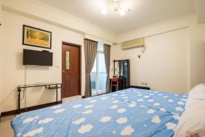 Postel nebo postele na pokoji v ubytování Jing Dian Homestay
