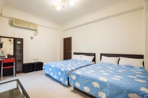 Postel nebo postele na pokoji v ubytování Jing Dian Homestay