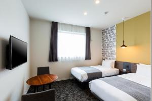 Кровать или кровати в номере M's Hotel Gojo Odawara