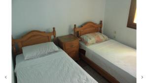 Postel nebo postele na pokoji v ubytování Harmony Hotel