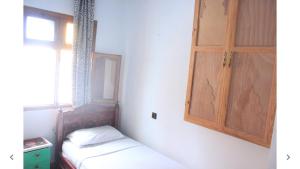 Postel nebo postele na pokoji v ubytování Harmony Hotel