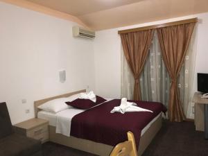 Postel nebo postele na pokoji v ubytování Hotel Ami - M