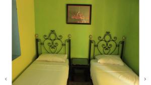 Postel nebo postele na pokoji v ubytování Harmony Hotel