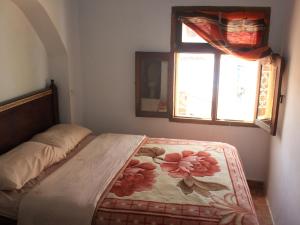 Una cama o camas en una habitación de Harmony Hotel