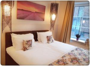 Voodi või voodid majutusasutuse Vivulskis Apart-Hotel toas
