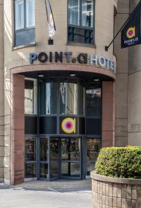 a building with a sign on the front of it at Point A Hotel Edinburgh Haymarket in Edinburgh