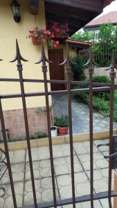 a metal fence with arrows in front of a building at Къща за гости Фантазия in Tryavna