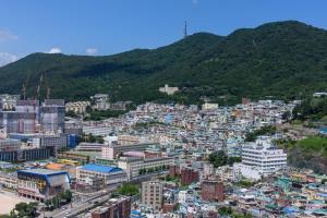 a large city with many buildings and a sky background at Avani Central Busan in Busan
