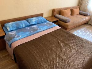 Łóżko lub łóżka w pokoju w obiekcie Апартаменты LUX в центре