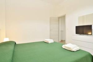 A bed or beds in a room at ragusa curtigghiu