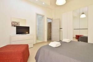 A bed or beds in a room at ragusa curtigghiu