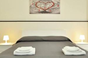 A bed or beds in a room at ragusa curtigghiu