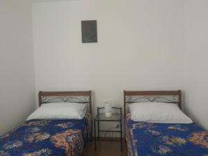Una cama o camas en una habitación de Apartmani Alma