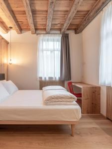 Posteľ alebo postele v izbe v ubytovaní Alla Stazion Locanda nelle Dolomiti