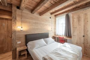 Posteľ alebo postele v izbe v ubytovaní Alla Stazion Locanda nelle Dolomiti