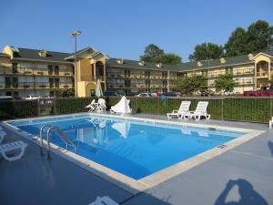 a swimming pool in front of a hotel at Baymont by Wyndham Sevierville Pigeon Forge in Sevierville