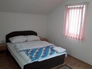 Postel nebo postele na pokoji v ubytování Motel Tetrijeb Sipovo