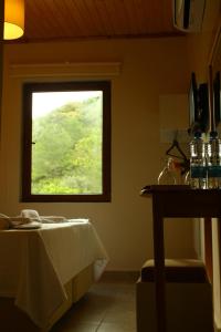 a room with a table and a window at Uyku Vadisi Hotel in Ağaçlıhüyük