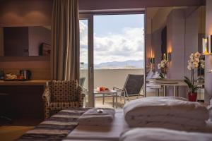 Ένα ή περισσότερα κρεβάτια σε δωμάτιο στο Jazz Hotel
