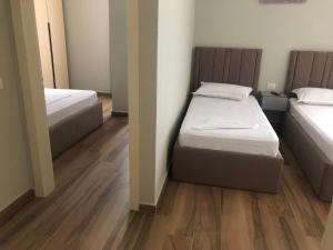 Postel nebo postele na pokoji v ubytování Julius Hotel