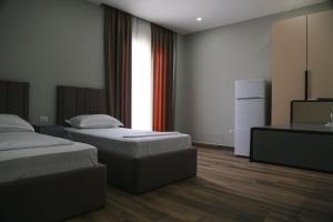 Postel nebo postele na pokoji v ubytování Julius Hotel