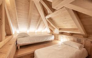 Posteľ alebo postele v izbe v ubytovaní Alla Stazion Locanda nelle Dolomiti