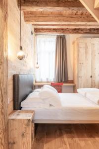 Posteľ alebo postele v izbe v ubytovaní Alla Stazion Locanda nelle Dolomiti
