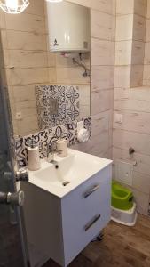 a bathroom with a sink and a green toilet at Apartament Baltic Relax in Rowy +27 photos