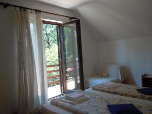 Postel nebo postele na pokoji v ubytování Apartmani Sobe BILJANA