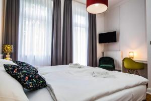 Postel nebo postele na pokoji v ubytování Kleines Hotel Heimfeld + 7 fotografií